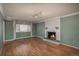 Living room with hardwood floors and a fireplace at 900 Emerald St, Broomfield, CO 80020