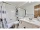 Clean bathroom with a white vanity, updated fixtures, and a shower-tub combo at 10150 E Virginia Ave # 7-302, Denver, CO 80247