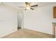 Cozy bedroom features a ceiling fan and an en-suite bathroom at 10150 E Virginia Ave # 7-302, Denver, CO 80247