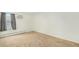 Well-lit bedroom features neutral paint, carpet, and a window with privacy blinds at 10150 E Virginia Ave # 7-302, Denver, CO 80247