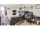 Comfortable bedroom with neutral carpet, artwork, and space for relaxation and work at 10150 E Virginia Ave # 7-302, Denver, CO 80247
