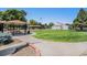Green space within community featuring playground, volleyball court, and seating areas at 10150 E Virginia Ave # 7-302, Denver, CO 80247