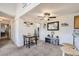 Open dining area includes a table set for two and a decorative accent cabinet with mirror at 10150 E Virginia Ave # 7-302, Denver, CO 80247