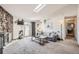 Bright living room features a stone fireplace, plush carpet, and sliding glass doors to a patio at 10150 E Virginia Ave # 7-302, Denver, CO 80247
