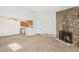 Inviting living room featuring a stone fireplace and open layout to the kitchen at 10150 E Virginia Ave # 7-302, Denver, CO 80247