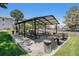 Community picnic area featuring covered tables and BBQ grills for outdoor gatherings and enjoyment at 10150 E Virginia Ave # 7-302, Denver, CO 80247