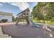 Community playground with wooden play structure, slide, and climbing features for outdoor fun at 10150 E Virginia Ave # 7-302, Denver, CO 80247