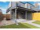 Private backyard with covered patio and artificial turf at 1442 S Logan St, Denver, CO 80210