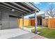 Backyard with covered patio and fenced yard at 1442 S Logan St, Denver, CO 80210