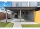 Covered patio and artificial turf in backyard at 1442 S Logan St, Denver, CO 80210