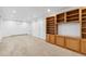 Spacious basement with neutral carpeting and ample storage at 1442 S Logan St, Denver, CO 80210