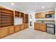 Basement kitchenette with wood cabinets and mini-fridge at 1442 S Logan St, Denver, CO 80210