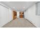 Open basement floor plan with kitchenette and built-in shelving at 1442 S Logan St, Denver, CO 80210