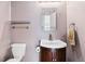 Small bathroom with toilet, sink, and vanity at 1442 S Logan St, Denver, CO 80210