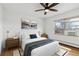 Bedroom with wood flooring, large bed and window at 1442 S Logan St, Denver, CO 80210