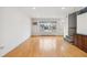 Bright living room with hardwood floors and large window at 1442 S Logan St, Denver, CO 80210
