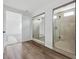 Bathroom showcasing glass-enclosed showers and modern design at 25323 E Warren Pl, Aurora, CO 80018