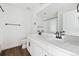 Well-lit bathroom with a double sink vanity, white cabinets, and contemporary black fixtures at 25323 E Warren Pl, Aurora, CO 80018