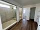 Modern bathroom with dual shower and tile floors at 25323 E Warren Pl, Aurora, CO 80018