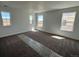 A spacious carpeted bedroom with three windows and lots of natural light at 25323 E Warren Pl, Aurora, CO 80018