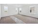 Spacious bedroom with multiple windows providing plenty of natural light and carpeting at 25323 E Warren Pl, Aurora, CO 80018
