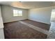 Carpeted bedroom with large window at 25323 E Warren Pl, Aurora, CO 80018