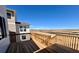 Wooden deck with wooden rails overlooking neighborhood at 25323 E Warren Pl, Aurora, CO 80018