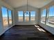 Bright dining area with hardwood floors, slider and large windows offering a nice view at 25323 E Warren Pl, Aurora, CO 80018