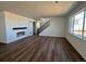 Open concept living room featuring hardwood floors and a staircase at 25323 E Warren Pl, Aurora, CO 80018
