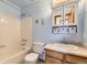 Bathroom featuring white tiled shower and vanity at 5713 Whitechapel St, Castle Rock, CO 80104