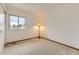 Well-lit bedroom with carpet and a bright window at 5713 Whitechapel St, Castle Rock, CO 80104