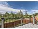 Back deck overlooking lush trees and neighborhood at 5713 Whitechapel St, Castle Rock, CO 80104