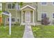 Charming covered front porch with number 5713, concrete steps, and a freshly cut lawn at 5713 Whitechapel St, Castle Rock, CO 80104
