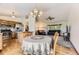 Open-concept living space with hardwood floors, a chandelier, eat-in kitchen, and comfortable seating arrangement at 5713 Whitechapel St, Castle Rock, CO 80104