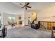 Spacious living area leading into the kitchen and dining area with hardwood floors at 5713 Whitechapel St, Castle Rock, CO 80104