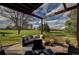 Outdoor living space features a pergola, comfortable seating, and a scenic view of the golf course, ideal for relaxing and entertaining at 5745 W Mansfield Ave # 265, Denver, CO 80235