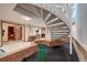 Basement rec room with putting green, spiral stairs, wet bar and sauna at 5745 W Mansfield Ave # 265, Denver, CO 80235