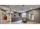 Spacious finished basement featuring neutral paint colors, plush carpeting, and a cozy seating area, perfect for relaxation or entertainment at 5745 W Mansfield Ave # 265, Denver, CO 80235