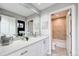 Modern bathroom with a double sink vanity, large mirror, and a separate toilet and shower area at 5745 W Mansfield Ave # 265, Denver, CO 80235