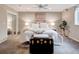 Bright bedroom featuring neutral walls, plush carpeting, a cozy bed with soft bedding, and sliding closet doors, maximizing space and comfort at 5745 W Mansfield Ave # 265, Denver, CO 80235