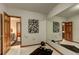 Bright exercise room featuring mirrored wall, rubber mat and access to wet bar and sauna at 5745 W Mansfield Ave # 265, Denver, CO 80235