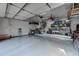 Clean, organized garage features epoxy floors, ample storage, and high ceilings, perfect for vehicle storage and workshop activities at 5745 W Mansfield Ave # 265, Denver, CO 80235