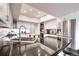 Bright kitchen boasts stainless steel appliances, black countertops, white cabinetry, and modern fixtures at 5745 W Mansfield Ave # 265, Denver, CO 80235