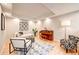 Bright room featuring hardwood floors, recessed lighting, modern furniture, and a cozy atmosphere at 5745 W Mansfield Ave # 265, Denver, CO 80235