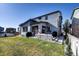 Well-maintained backyard features lush grass, a patio, and a privacy fence creating a serene outdoor space at 18085 E 107Th Pl, Commerce City, CO 80022