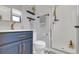 Stylish bathroom featuring a vanity with copper fixtures and a glass-enclosed shower at 18085 E 107Th Pl, Commerce City, CO 80022