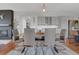 Elegant dining room features a modern chandelier, stylish chairs, and open layout at 18085 E 107Th Pl, Commerce City, CO 80022