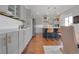 Open kitchen with island, gray cabinets, stainless appliances, and pendant lights at 18085 E 107Th Pl, Commerce City, CO 80022