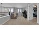 Cozy loft featuring a comfortable couch and a view from the windows at 18085 E 107Th Pl, Commerce City, CO 80022