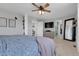 Serene main bedroom with decorative wall art, a ceiling fan, and an ensuite bathroom at 18085 E 107Th Pl, Commerce City, CO 80022